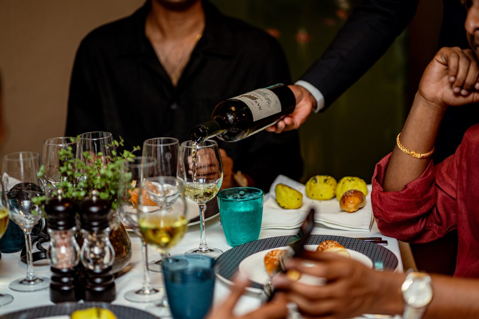 Wine service in the dining room at Amigo