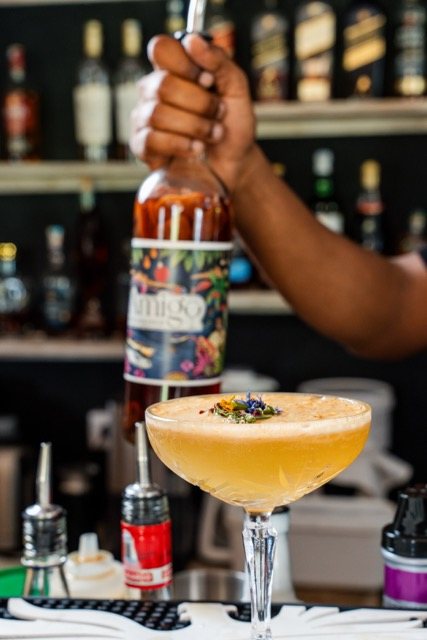 A coupe cocktail poured at the bar at Amigo