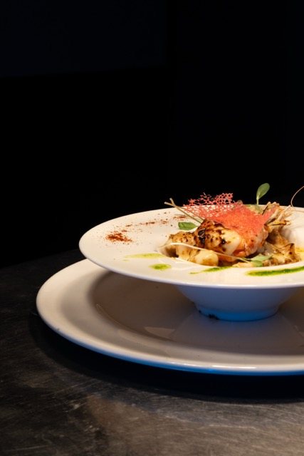 Seafood gratin served in a footed soup bowl at Amigo