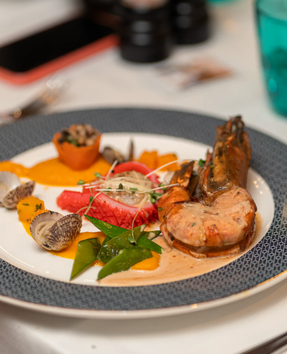Grilled prawns, clams and ourite with vegetables, plated at Amigo Restaurant, Cap Malheureux